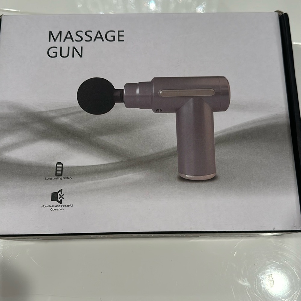 Rechargeable massage gun in box